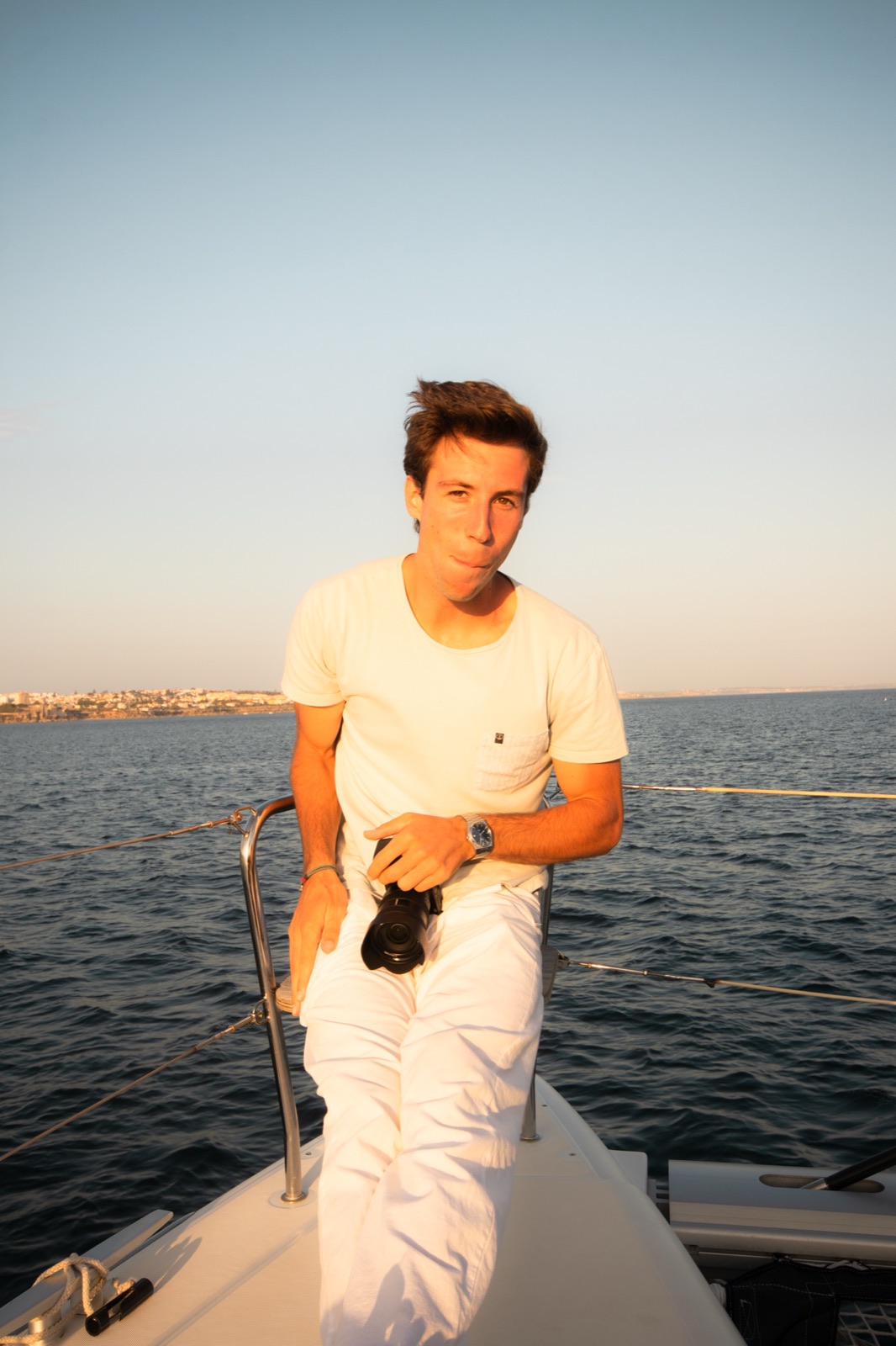 Miguel Moura on a boat at sunset
